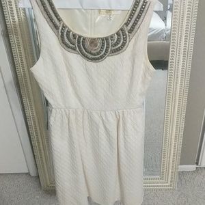 Cream textured dress with decorative collar